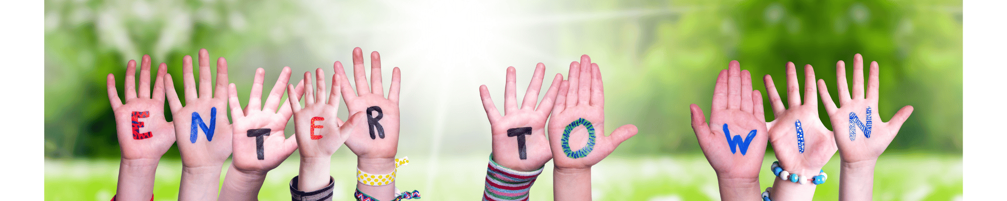 Image of kids hands with Enter to Win painted on their palms